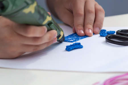 3d handle pen. Colored plastic in coils. Hahdmade education activity.の写真素材