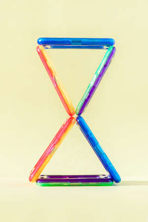 Colorful magnetic building blocks on pastel backgroundの写真素材