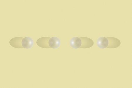 white balls with different unreal shadows on yellow background. Unreal minimal concept.