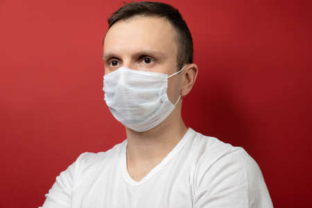 Portrait of a man with a surgical maskの写真素材