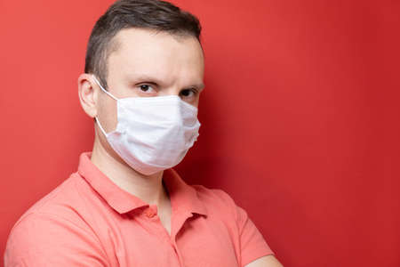 Portrait of a man with a surgical maskの写真素材