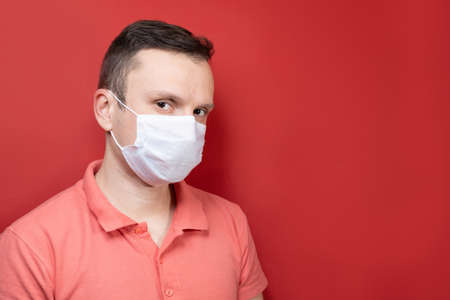 Portrait of a man with a surgical maskの写真素材