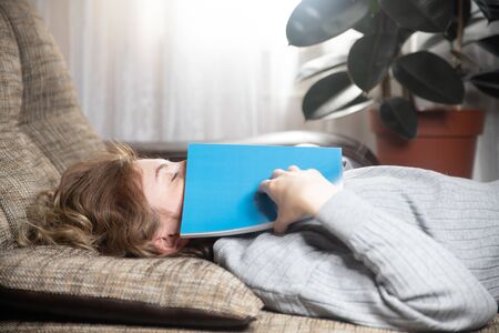 Beautiful young girl sleeping on the couch in the living room