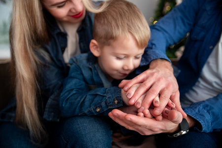 Family holding hands close-up. happy family. A close-knit happy family. Mom dad son.の写真素材