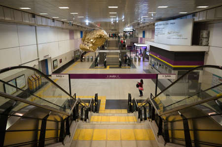 Buenos Aires, Argentina - January, 2020: Interior of Correo Central subway station on Line E (Linea E). Escalators, stairs and hanging heads sculptures on new metro station.のeditorial素材