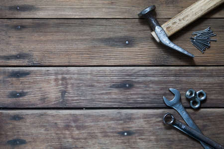 Hammer and nails on wooden backgroundの写真素材