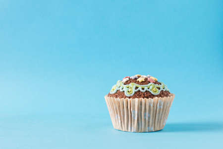 homemade muffin, cupcake on a blue backgroundの写真素材