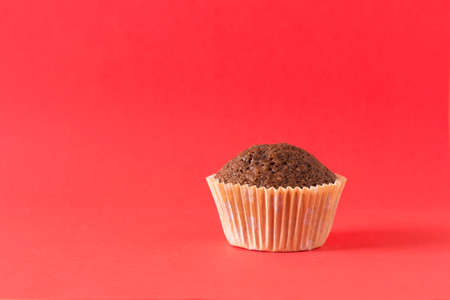 homemade muffin on a red backgroundの写真素材