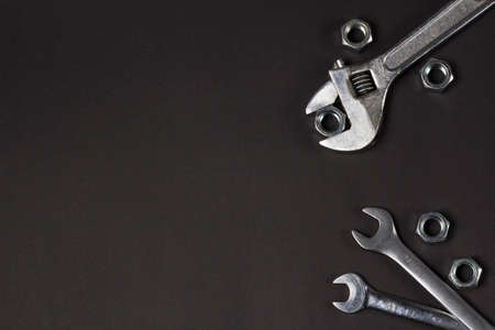 spanners and screw-nut on black backgroundの写真素材