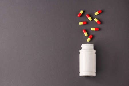 a lot of capsules on a gray backgroundの写真素材