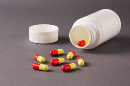 pills, vitamins, capsules on a gray backgroundの写真素材