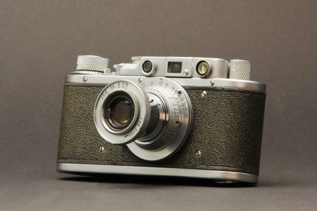 Antique black silver camera on a gray backgroundの写真素材