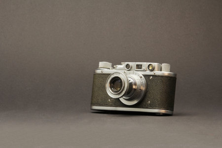 gray background with old cameraの写真素材