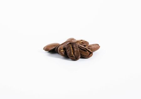 roasted coffee beans isolated on white background. with shadowの写真素材
