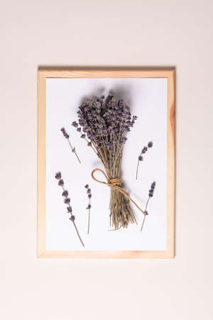 mock up for text, top view, white sheet of paper in a frame with lavender flowers