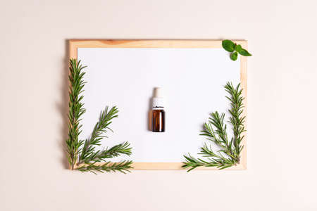 top view, white sheet of paper with rosemary, essential oilの写真素材