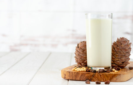 cedar milk on a white wooden tableの写真素材