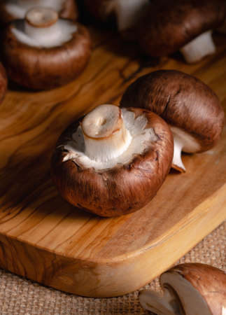 still life, mushrooms champignons on a wooden boardの写真素材