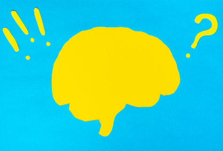 problem concept, yellow brain layout with question and exclamation marks on blue backgroundの写真素材