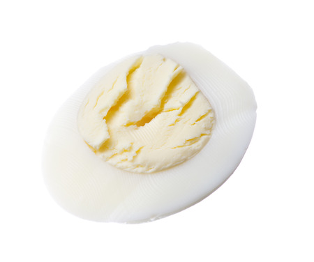 Chicken egg in a cut isolated on white backgroundの写真素材