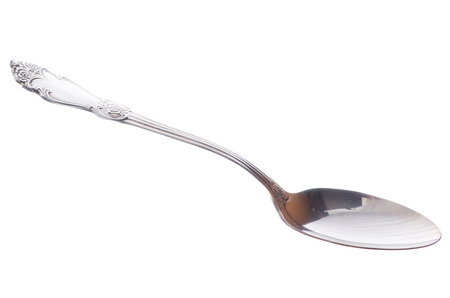 vintage spoon closeup isolated on white backgroundの写真素材