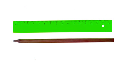 green ruler and pencil isolated on white background.の写真素材