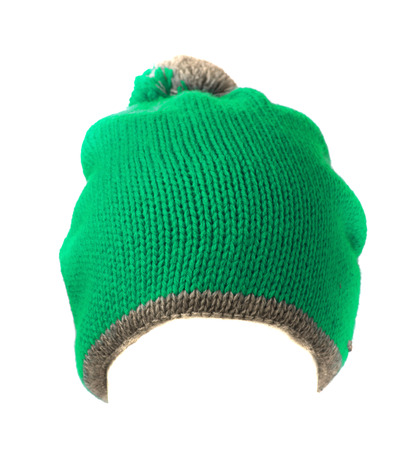 turquoise blue knitted hat with pompom isolated on white background .の写真素材