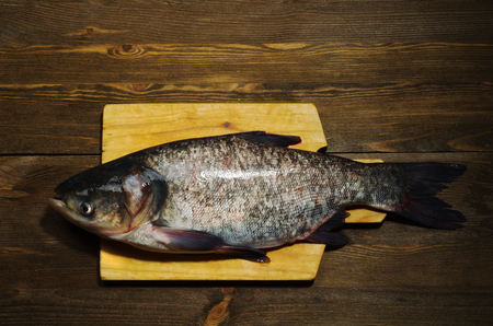 raw fish on wooden table as background .の写真素材