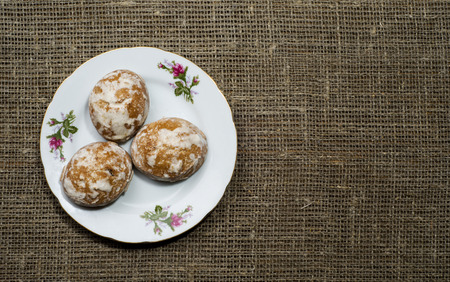 gingerbread cookies arranged on a wooden slope in the background .の写真素材