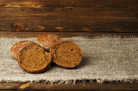 bread placed on a wooden slope in the background .