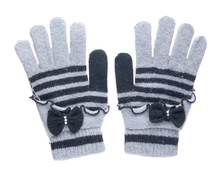 knitted gloves. gloves isolated on white background. gloves a top view.gray gloves with blue stripes .の写真素材