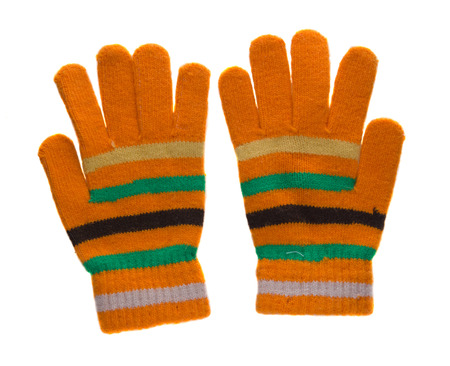 knitted gloves. gloves isolated on white background. gloves a top view.yellow gloves in green black and white stripes .の写真素材