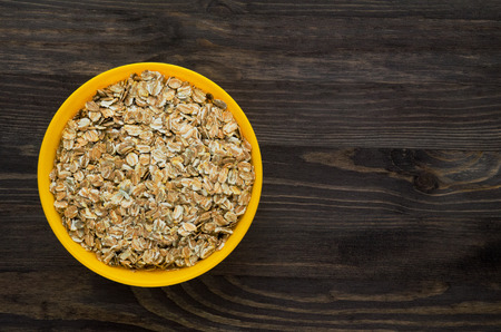 muesli with nuts. muesli on a wooden table. muesli top view . healthy foodの写真素材