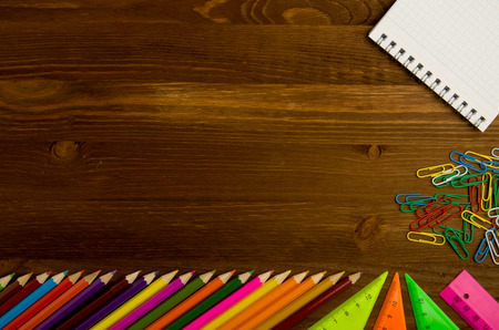 School supplies (pencil, pen, ruler, triangle) on blackboard background ready for your design .school supplies top view .の写真素材