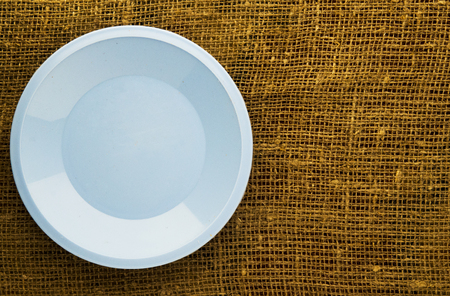 plate on a wooden background.blue plate. plate top view. copy space .の写真素材