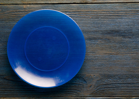 plate on a wooden background. plate top view. copy space .の写真素材