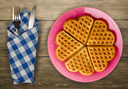 Belgian waffles wooden background. waffles on a plate top viewの写真素材