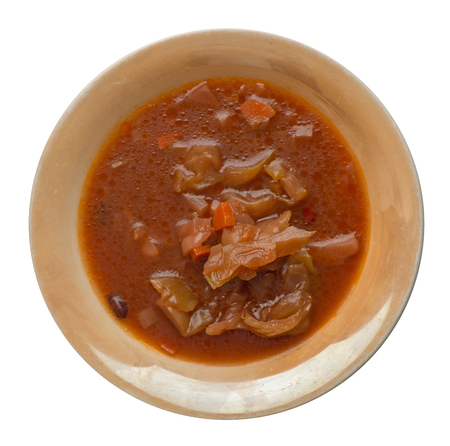 vegetable soup isolated on white background .vegetable soup in brown plate top viewの写真素材