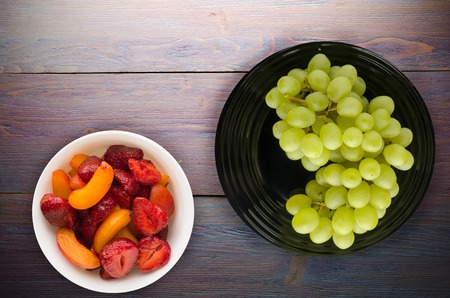 grapes on a wooden background. grapes on a plate .の写真素材