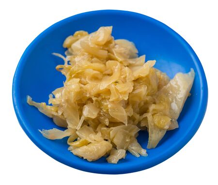 braised cabbage in blue  plate isolated on white background. braised cabbage top side view .healthy food. veretian foodの写真素材