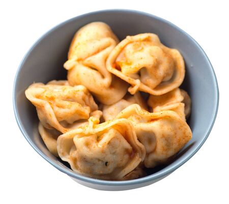 dumplings on a gray plate isolated on white background. dumplings in tomato sauce. dumplings top side  viewの写真素材