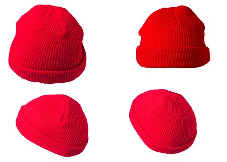 set of four red knitted hats isolated on a white background. trendy winter hatsの写真素材