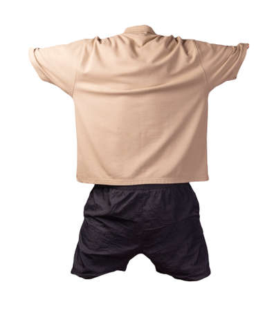 men's sports black shorts and lignt brow t-shirt with a button-down collar isolated on a white background.comfortable clothing for sportsの写真素材