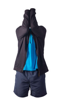 black sweatshirt with iron zipper hoodie, blue polo shirt and dark blue sports shorts isolated on...