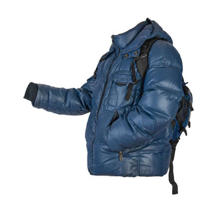blue backpack dressed in dark blue down jacket with hood isolated on a white background. rear view of a backpack and jacketの写真素材
