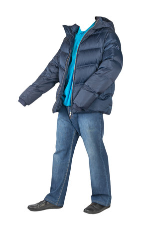 dark blue jeans, blue t-shirt with a collar on buttons, dark blue down jacket with hoodand and black leather shoes isolated on white backgroundの写真素材