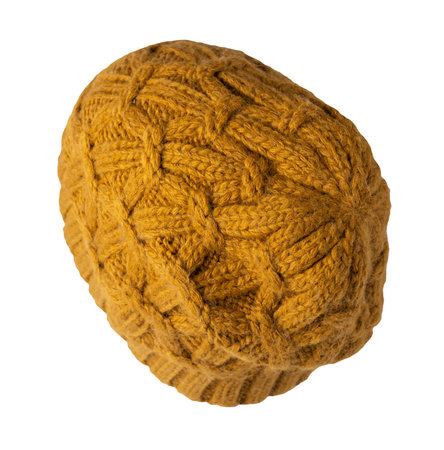 women's dark yellow knitted hat isolated on white background. warm winter accessoryの写真素材