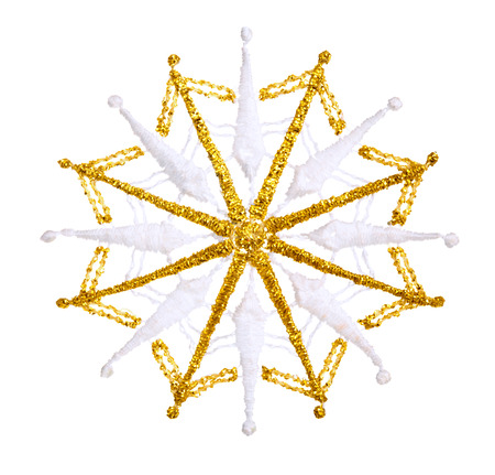 Golden snowflake isolated on white background.の写真素材
