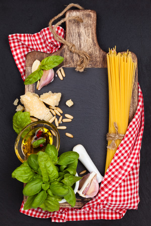 Italian Food. Italian pasta and pesto ingredients on black slate board.の写真素材