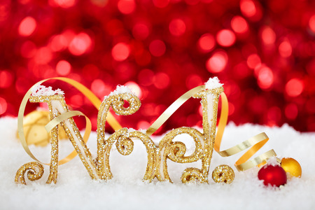 Christmas decoration with Noel sign against holiday lights.の写真素材